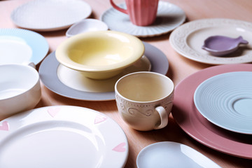 Composition of tableware on rosy background