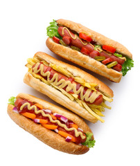 Three fresh hot dogs isolated on white