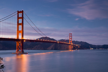 Fototapeta na wymiar Golden Gate Bridge at Dusk in San Francisco, California, USA. Taken from Battery E Trail near the Golden Gate Bridge Welcome Center.