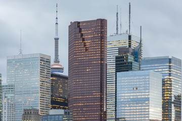 Fototapeta na wymiar Tops of Skyscrapers in the Financial District of Toronto on the grey sky background 