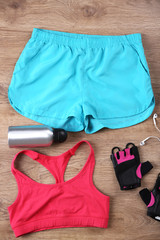 Sport equipment for woman  on wooden background