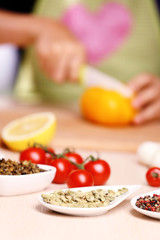 Variety of spices in ceramic containers on the kitchen table