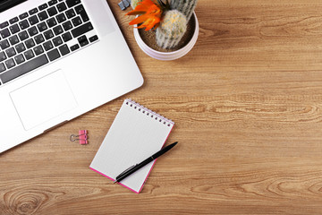 Top view of comfortable working place on wooden background
