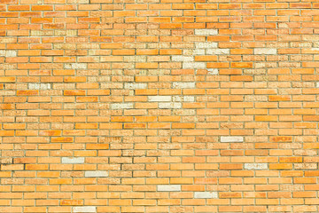 Orange brick wall as a nicely textured background