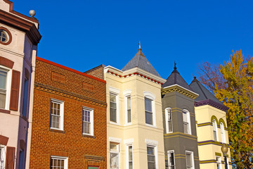 Fototapeta na wymiar Residential row houses in US Capital in autumn. Historic urban architecture of Washington DC, USA.