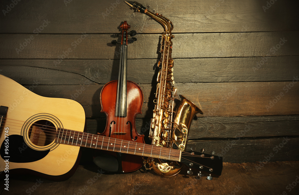 Wall mural Musical instruments on wooden background