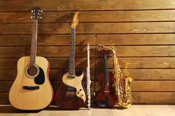 Musical instruments on wooden background