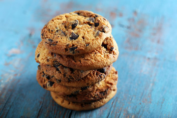 Close up focus view on cookies with chocolate crumbs on blue wooden table