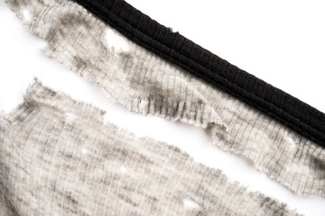 mans shirt worn out badly on white background