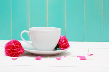 Coffee cup with pink carnations