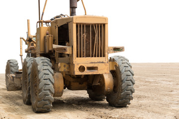 .yellow tractor with plow in the field