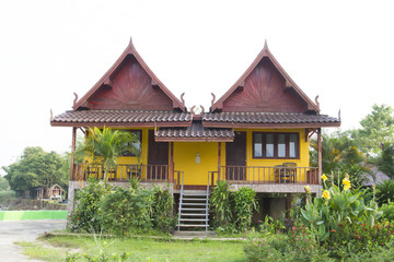 Twin Thai style wood house in Thailand
