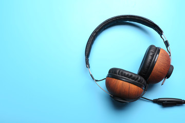 Black and brown headphones on blue background