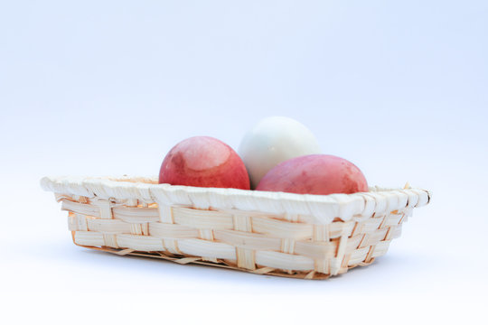 Egg in basket wicker on white background,raw eggs