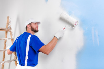 painter in white dungarees, blue t-shirt - 96571706