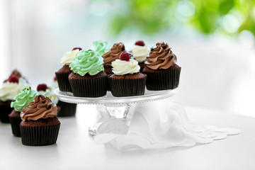 Beautiful chocolate cupcakes on table, close up