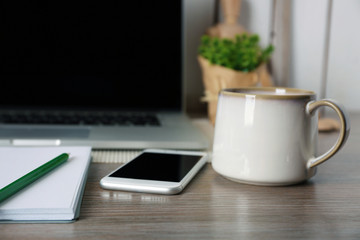 Decorated workplace with laptop in the modern room