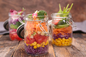 Fototapeta na wymiar homemade rainbow salad in jar