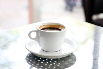 Cup of tasty coffee in cafe