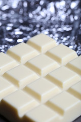 White Chocolate bar in foil, close-up