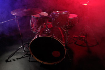 Drum set in smoke on a stage