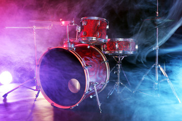 Drum set in smoke on a stage