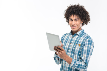 Smiling afro american man using tablet computer