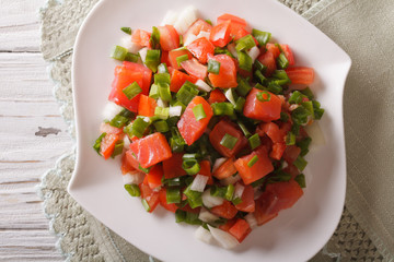 Hawaiian lomi lomi salad close-up on the table. Horizontal top view
