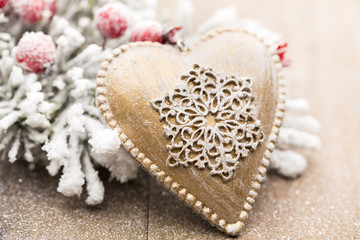 Christmas decoration with fir branches on the wood background.