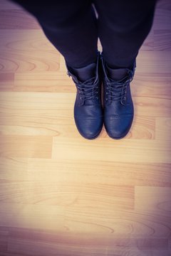 Cropped image of woman wearing boots