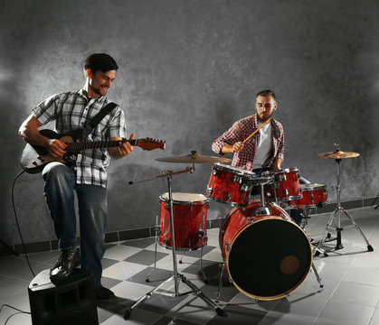 Musicians playing the drums in a studio