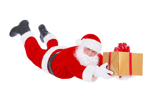 Santa Claus flying with Christmas gift isolated on white backgro