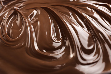 Background of melted milk chocolate, close-up