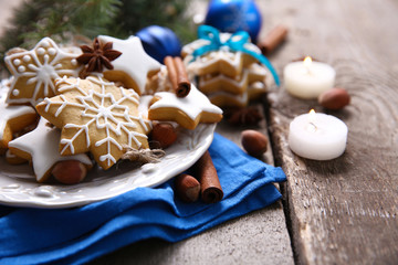 Cookies with spices and Christmas decor, on wooden table