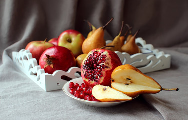 Still life with pomegranates and pears.