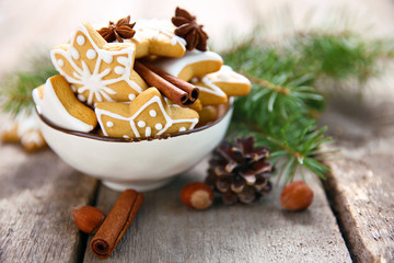Cookies with spices and Christmas decor, on wooden table