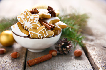 Cookies with spices and Christmas decor, on wooden table