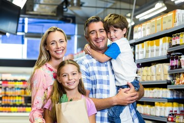 Happy family at the supermarket