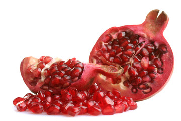 very juicy and big and delicious pomegranate in the section on white isolated background