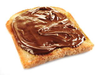 Chocolate poured on piece of bread isolated on white