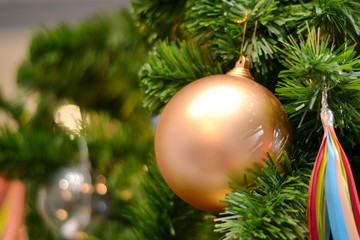 Christmas ball/Close-up of golden ball on christmas tree.