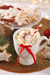 Beautiful composition with cup of cappuccino and Christmas cookies