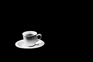 cup of coffee on black background