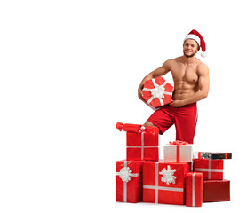 Feels like Christmas. Portrait of a toned man wearing Santa hat offering a pile of gifts isolated on white