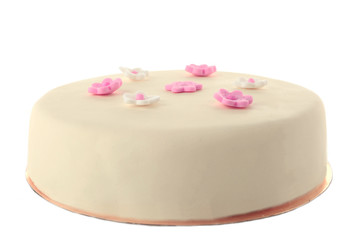 Cake with sugar paste flowers, isolated on white