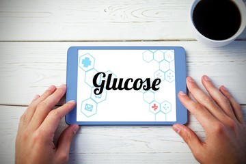 Glucose against person using tablet computer