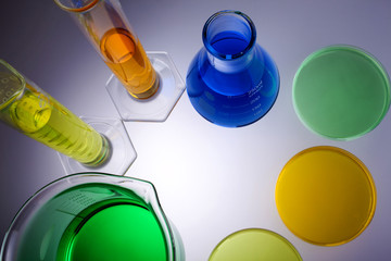 Laboratory equipment beakers test tubes and petrie dishes  shot from above