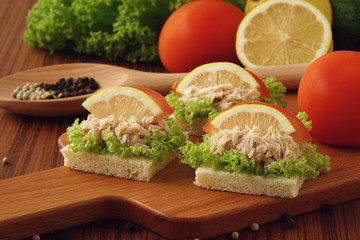 Tuna sandwich on chopping board