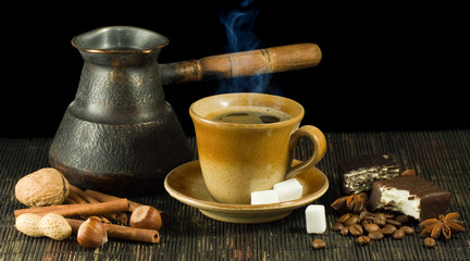  cup of coffee, cookies, coffee beans and cinnamon close-up