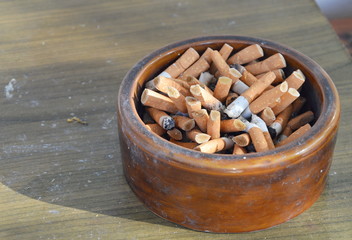 cigarette filter in ceramic ashtray